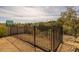 Black metal backyard fence overlooking desert landscaping and neighborhood views at 16414 N Dixie Mine Trl, Fountain Hills, AZ 85268