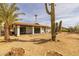 Expansive backyard featuring desert landscaping and a covered patio, perfect for outdoor entertaining at 16414 N Dixie Mine Trl, Fountain Hills, AZ 85268