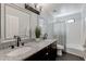 Modern bathroom with dual sinks, granite countertops, and dark wood cabinets at 16414 N Dixie Mine Trl, Fountain Hills, AZ 85268