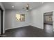 Cozy bedroom with hardwood floors, ceiling fan and bright natural light at 16414 N Dixie Mine Trl, Fountain Hills, AZ 85268