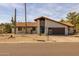 Attractive home with desert landscaping, a red tile roof, a brown garage door, and a turquoise front door at 16414 N Dixie Mine Trl, Fountain Hills, AZ 85268