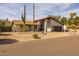 Inviting home with desert landscaping, a red tile roof, a brown garage door, and a turquoise front door at 16414 N Dixie Mine Trl, Fountain Hills, AZ 85268