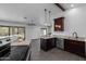 Kitchen featuring granite countertops, stainless steel appliances and dark wood cabinets at 16414 N Dixie Mine Trl, Fountain Hills, AZ 85268