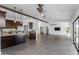 Spacious living room with hardwood floors, open floor plan, and adjacent kitchen at 16414 N Dixie Mine Trl, Fountain Hills, AZ 85268