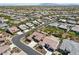 An aerial view of a planned community with lush landscaping at 16949 W La Reata Ave, Goodyear, AZ 85395