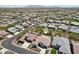 Expansive aerial view showcasing a well-planned community with uniform homes and manicured landscaping at 16949 W La Reata Ave, Goodyear, AZ 85395