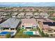 Aerial view of a house with a sparkling pool, lounge chairs, and desert landscaping at 16949 W La Reata Ave, Goodyear, AZ 85395