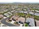 Expansive aerial view showcasing a well-planned community with uniform homes and manicured landscaping at 16949 W La Reata Ave, Goodyear, AZ 85395