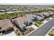 Expansive aerial view showcasing an exterior with tile roof, neutral exterior, and desert landscaping at 16949 W La Reata Ave, Goodyear, AZ 85395