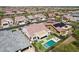 Aerial view of a house with a sparkling pool, lounge chairs, and desert landscaping at 16949 W La Reata Ave, Goodyear, AZ 85395