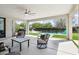 Covered back patio overlooking the backyard pool and lounge chairs at 16949 W La Reata Ave, Goodyear, AZ 85395