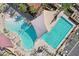 Top-down perspective of community pools, showcasing clear turquoise water, sunbathing areas, and shaded spots for relaxation at 16949 W La Reata Ave, Goodyear, AZ 85395