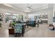 Bright living room featuring neutral tones, comfortable seating, and an open layout to the kitchen at 16949 W La Reata Ave, Goodyear, AZ 85395