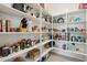 Spacious pantry with ample shelving, fully stocked with food and beverages at 16949 W La Reata Ave, Goodyear, AZ 85395
