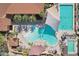 Aerial view of a resort-style pool area with palm trees and plenty of seating at 16949 W La Reata Ave, Goodyear, AZ 85395