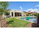 Backyard pool and patio area with ample lounge space at 16949 W La Reata Ave, Goodyear, AZ 85395