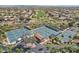 Wide aerial shot showcases the many tennis courts in a vibrant community setting at 16949 W La Reata Ave, Goodyear, AZ 85395