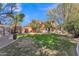 Spacious backyard with mature trees and a well-maintained lawn, offering ample privacy at 20709 N 59Th Dr, Glendale, AZ 85308