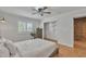 Bedroom with wood floors, closet, and doorway into a room with brickwork at 20709 N 59Th Dr, Glendale, AZ 85308