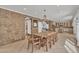 Dining room with rustic stone accents and views into the adjacent kitchen at 20709 N 59Th Dr, Glendale, AZ 85308