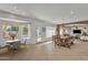 Bright staged dining room with natural light and backyard views at 20709 N 59Th Dr, Glendale, AZ 85308