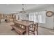 Spacious dining room featuring a large table and views into the kitchen at 20709 N 59Th Dr, Glendale, AZ 85308