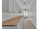 Bright hallway features bright cabinets with butcher block countertops at 20709 N 59Th Dr, Glendale, AZ 85308