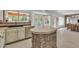 Open kitchen with stone island, stainless steel appliances, and views of backyard at 20709 N 59Th Dr, Glendale, AZ 85308