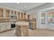 Open kitchen features granite countertops, stainless steel appliances, stone island, and ample storage at 20709 N 59Th Dr, Glendale, AZ 85308
