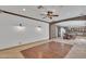 Expansive living room featuring tile floors, stone accents, recessed lights, and access to dining area at 20709 N 59Th Dr, Glendale, AZ 85308