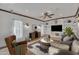 Staged living room with a ceiling fan, built-in shelving, and recessed lighting at 20709 N 59Th Dr, Glendale, AZ 85308