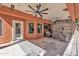 Comfortable covered patio with ceiling fans and stone accents, providing an excellent space for outdoor entertaining at 20709 N 59Th Dr, Glendale, AZ 85308