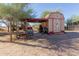 View of workshop with storage, lighting, and covered work area at 226 N 96Th St, Mesa, AZ 85207