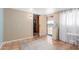 Flex room with terracotta tile floors, bright windows, and doorway to kitchen at 226 N 96Th St, Mesa, AZ 85207