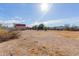 Wide angle view of the lot with accessory buildings on a sunny day at 226 N 96Th St, Mesa, AZ 85207