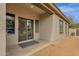 Covered back patio with sliding glass door offers indoor-outdoor flow to spacious, private backyard at 2514 E Espada Trl, Casa Grande, AZ 85194