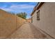 Narrow side yard featuring gravel path, and hammock at 2514 E Espada Trl, Casa Grande, AZ 85194