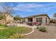 Outdoor patio with furniture, fire pit, grill, and fenced yard with grass lawn at 2514 E Espada Trl, Casa Grande, AZ 85194