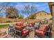 Outdoor patio with furniture, fire pit, grill, and fenced yard with grass lawn at 2514 E Espada Trl, Casa Grande, AZ 85194