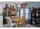 Charming dining room featuring a wooden table, stylish decor, and natural light at 2514 E Espada Trl, Casa Grande, AZ 85194