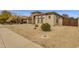 Charming single-story home featuring neutral stucco, stone accents, and low-maintenance desert landscaping at 2514 E Espada Trl, Casa Grande, AZ 85194