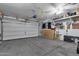 Spacious two car garage with ceiling fan, automatic door openers and wall storage at 2514 E Espada Trl, Casa Grande, AZ 85194