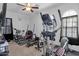 Well-equipped home gym featuring elliptical trainer and weightlifting bench at 2514 E Espada Trl, Casa Grande, AZ 85194