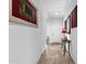Bright hallway with neutral walls, tile flooring, and decorative accents at 2514 E Espada Trl, Casa Grande, AZ 85194