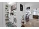 Convenient laundry room with washer, dryer, shelving, and ample storage space at 2514 E Espada Trl, Casa Grande, AZ 85194