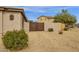 Gated side yard with a block wall, desert landscaping, and space for outdoor activities at 2514 E Espada Trl, Casa Grande, AZ 85194