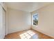 Clean, minimalist bedroom features a large window and smooth laminate flooring at 2910 W Marconi Ave # 105, Phoenix, AZ 85053