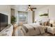 Serene bedroom with a bay window, ceiling fan, and ample natural light at 2910 W Marconi Ave # 105, Phoenix, AZ 85053