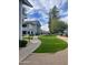 Well-maintained exterior featuring lush green grass, manicured landscaping, and covered parking at 2910 W Marconi Ave # 105, Phoenix, AZ 85053