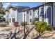 Two-story condo with classic architectural details, complemented by desert landscaping and shade trees at 2910 W Marconi Ave # 105, Phoenix, AZ 85053